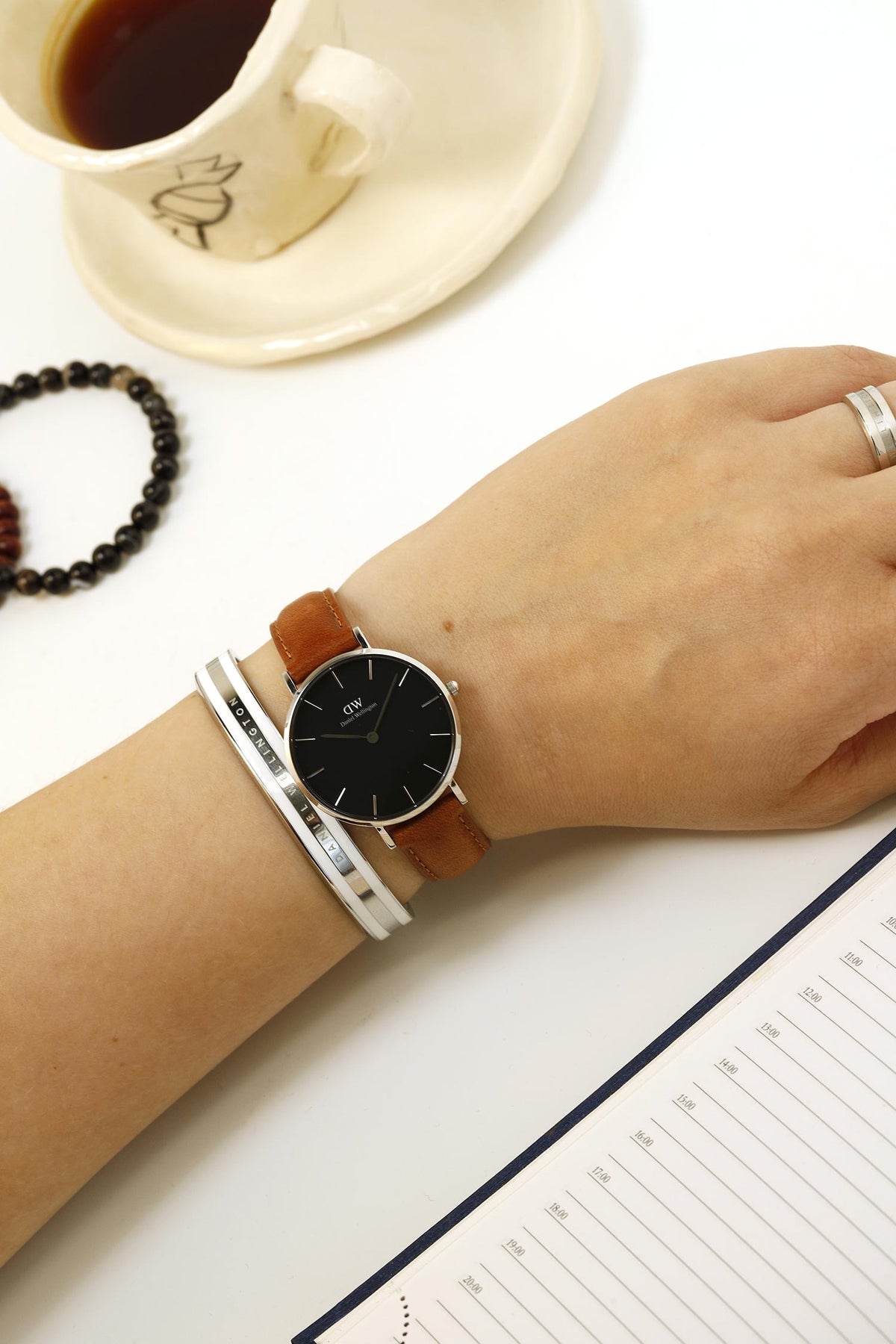 Shop Authentic Daniel Wellington Petite Sterling Black Dial Brown Leather Strap Watch For Women - DW00100178 - Luxxuri