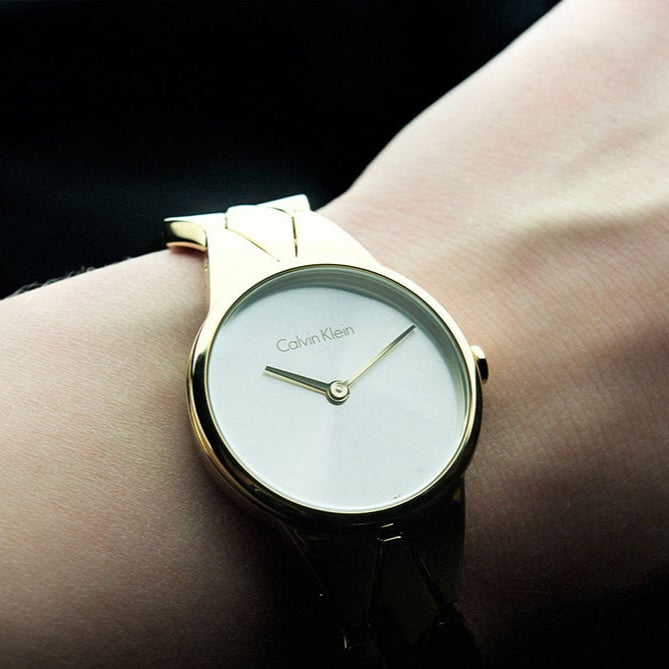 Shop Authentic Calvin Klein Snake Silver Dial Yellow Gold Steel Strap Watch For Women - K6E23546 - Luxxuri